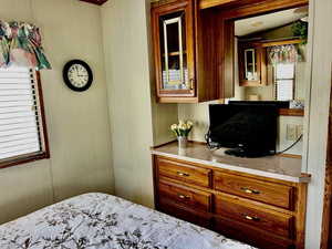 Bedroom featuring lofted ceiling