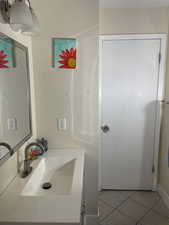 Bathroom featuring tile patterned floors and vanity