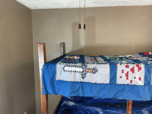 Bedroom # 2 with a textured ceiling