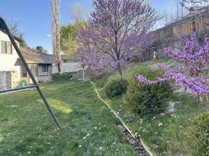 View of yard featuring fence