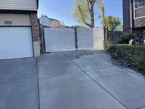 View of gate with fenceAdditional Ample concreted areasthe other side of gate