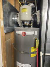 Basement utility room with water heater