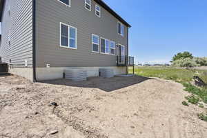 View of home's exterior with central AC unit