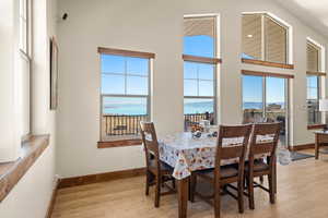 Dining space with Bear Lake view, table seats 6 plus 4 at the kitchen island plus more on the deck