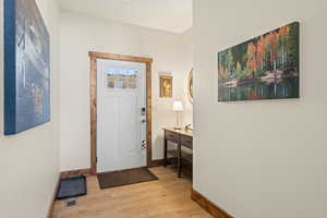 Entry featuring  LVP flooring,  10' ceilings