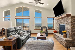 Great Room  featuring high vaulted cathedral ceiling, front glass gable end facing the lake