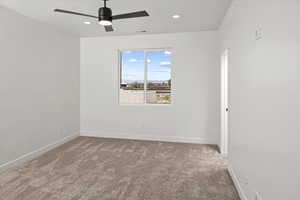 Spare room with baseboards, carpet flooring, recessed lighting, and ceiling fan