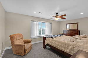 Bedroom with carpet flooring, baseboards, visible vents, recessed lighting, and ceiling fan