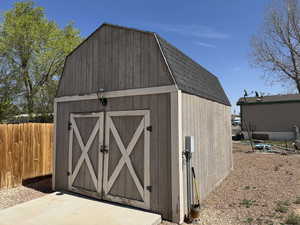 View of shed with fence