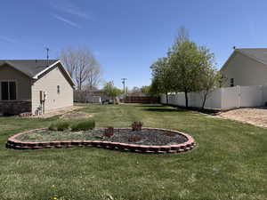 View of yard featuring fence