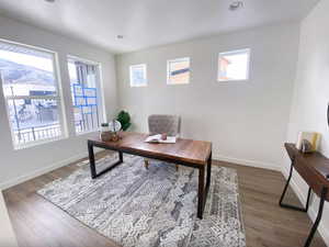 Office area with wood finished floors, baseboards, and recessed lighting