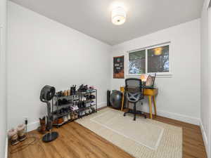 Office with baseboards and wood finished floors