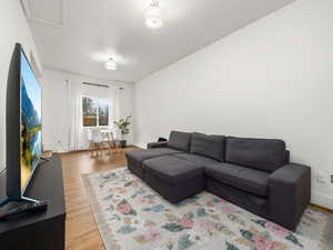 Living room featuring wood finished floors and baseboards