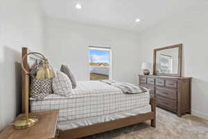 Bedroom featuring light carpet and recessed lighting