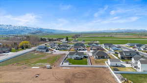 Drone / aerial view featuring a mountain view and a residential view