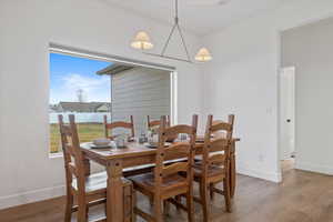 Dining space featuring baseboards and wood finished floors