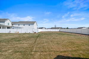 View of yard featuring fence