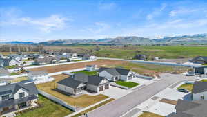 Drone / aerial view featuring a residential view and a mountain view