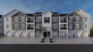 View of front facade featuring an attached garage, driveway, and board and batten siding