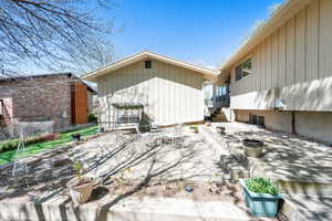 Rear view of property featuring fence, a patio area, and entry steps