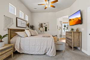 Bedroom featuring carpet, visible vents, a ceiling fan, connected bathroom, and baseboards