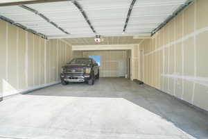 Garage featuring a garage door opener