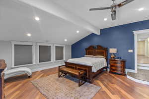 Bedroom with vaulted ceiling with beams, visible vents, recessed lighting, wood finished floors, and ceiling fan