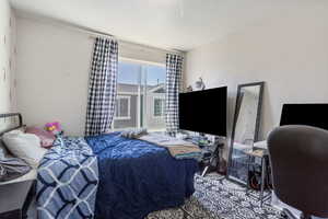 Bedroom with a textured ceiling