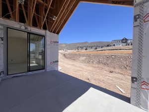 Covered patio featuring a mountain view