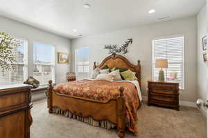 Master Suite with Carpe, and recessed lighting and en suite bathroom and walk in closet