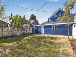 View of yard featuring fence