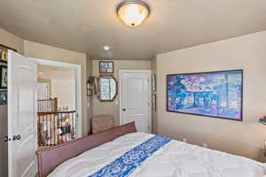 Bedroom featuring a textured ceiling