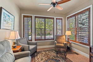Sitting room featuring baseboards, a healthy amount of sunlight, and visible vents