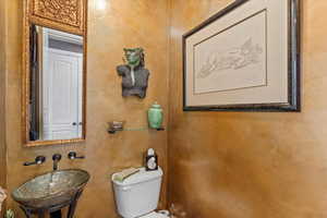 Bathroom featuring toilet and a sink