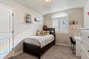 Bedroom with baseboards and carpet flooring