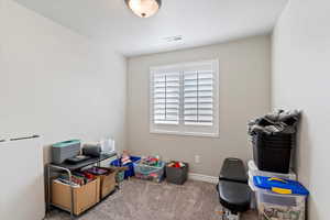 Game room with baseboards, carpet flooring, and visible vents