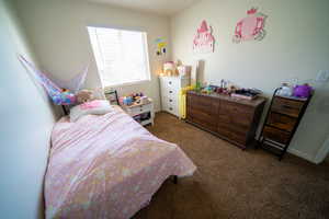 Bedroom featuring baseboards and carpet flooring