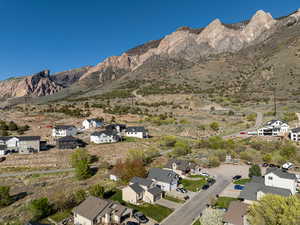 Property view of mountains with a residential view