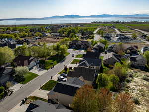 Birds eye view of property with a residential view and a water and mountain view