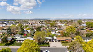 Birds eye view of property featuring a mountain view and a residential view