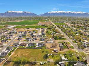 Birds eye view of property with a mountain view and a residential view