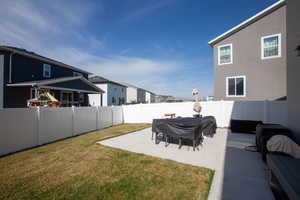 View of yard featuring a patio area and a fenced backyard