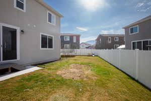 View of yard with a fenced backyard, a residential view.