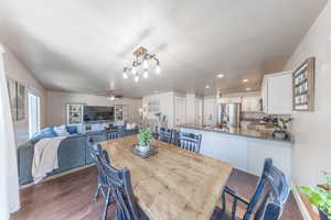 Dining area featuring dark wood-style floors, a textured ceiling, a ceiling fan, and recessed lighting