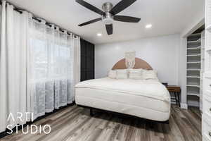 Bedroom with baseboards, a ceiling fan, wood finished floors, and recessed lighting