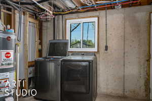 Clothes washing area with gas water heater, washer and dryer, and laundry area