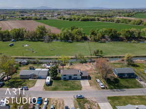 Birds eye view of property with a rural view and a mountain view