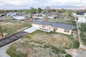 Birds eye view of property with a mountain view