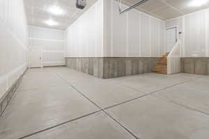 Garage featuring a garage door opener