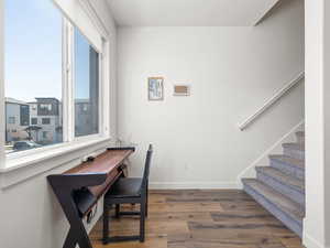 Office area with wood finished floors and baseboards